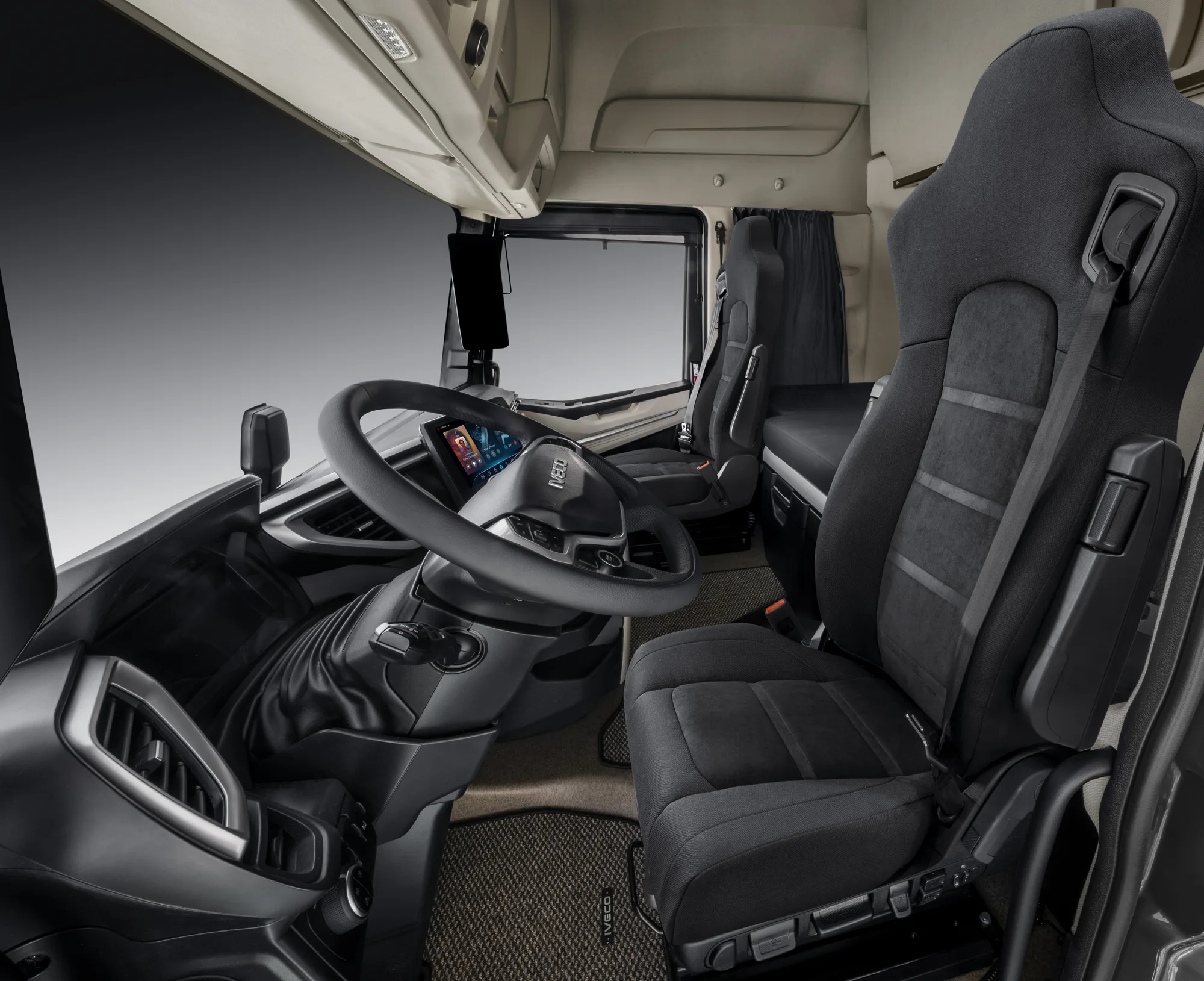 Cockpit of the IVECO Strator with upright steering wheel position and seats